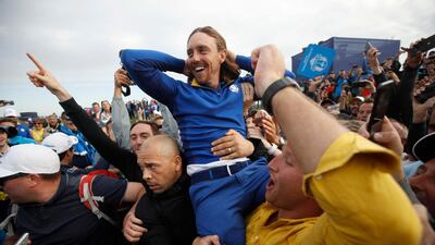 Tommy Fleetwood celebrates with spectators after winning the Ryder Cup. Reuters