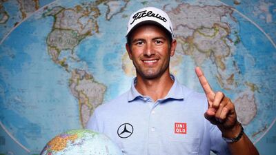Adam Scott poses with a globe after becoming world No 1 ahead of the Crowne Plaza Invitational at Colonial, starting on Thursday May 22, 2014. Tom Pennington / Getty Images / AFP