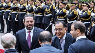 Lebanese Prime Minister Saad Hariri (left) and Egyptian Prime Minister Mostafa Madbouly (second left) shake hands with Lebanese ministers during a welcoming ceremony at the government palace in downtown Beirut, Lebanon. EPA