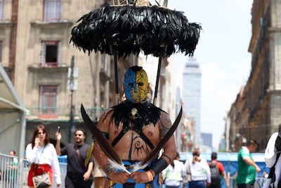 A Mexican supporter in an Aztec-style warrior costume. AFP