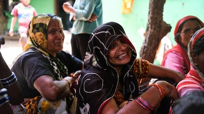 Relatives mourn Sunil Kumar, 24, who died after getting crushed under the debris of a ceiling that fell in heavy storm winds in Kheragarh on the outskirts of Agra. Chandan Khanna / AFP