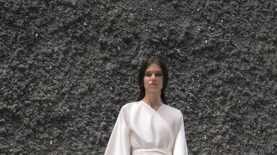A sparse yet stylish white robe dress from SH Studio