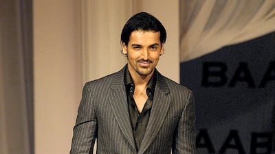 Abraham walking the ramp at the music launch of the film 'Babul' in Mumbai, in October 2006. AFP Photo.