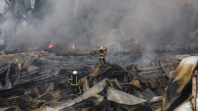Rescuers work at the site of a Russian missile strike on a goods storage in Kyiv, Ukraine. EPA
