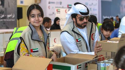 Volunteers boxed up food, hygiene and medical supplies