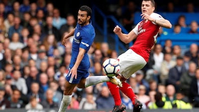 Chelsea's Pedro in action with Arsenal's Granit Xhaka. John Sibley / Reuters