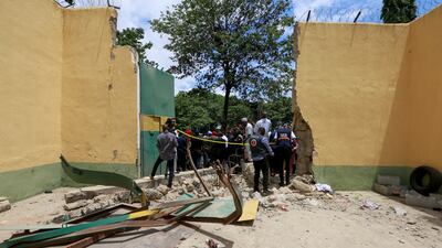 The main prison door was destroyed during the attack. Reuters