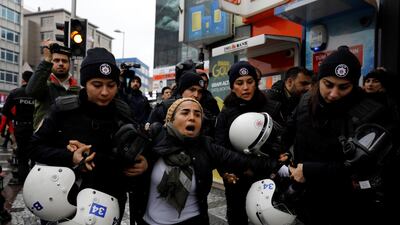 Riot police detain a demonstrator during a protest against Turkey's military operation in Syria's Afrin region. 311 people including journalists and activists had been detained over accusations they were spreading "terror propaganda". Umit Bektas / Reuters