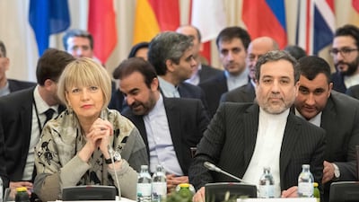 Abbas Araghchi, political deputy at the Ministry of Foreign Affairs of Iran sits next to the Secretary General of the European Union External Action Service (EEAS), Helga Schmid, during talks in Vienna this month on the Iran nuclear deal. Joe Klamar / AFP
