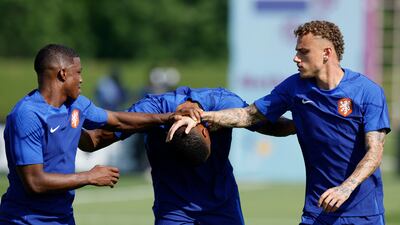 Netherlands' Tyrell Malacia, Denzel Dumfries and Noah Lang. Reuters