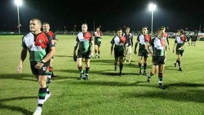 Abu Dhabi Harlequins leave the field following their match with Doha yesterday.