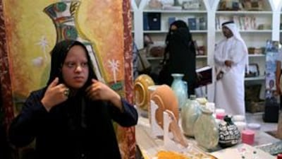Badriyah Essah displays her handicrafts at the new shop in Al Arsa souk.