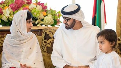 Sheikh Mohammed bin Zayed, Crown Prince of Abu Dhabi and Deputy Supreme Commander of the UAE Armed Forces (centre), seen with Sheikh Mohammed's grandson, Sheikh Tahnoon bin Mohammed bin Tahnoon Al Nahyan (right) talking to Malala Yousafzai (left), when she visited the UAE in May 2013. Courtesy Wam