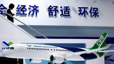 A visitor walks down from a mock-up of Chinese-made C919 passenger airliner at the 8th China International Aviation and Aerospace Exhibition (Zhuhai Airshow) in Zhuhai, southern coast of Guangdong province, China, Monday, Nov. 15, 2010. The airshow will runs from Nov. 16 to Nov. 21, 2010. (AP Photo/Kin Cheung) *** Local Caption *** XKC115_China_Airshow.jpg