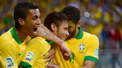 Neymar, centre, was a happy man after Brazil beat Italy, but he refused to get carried away. Christophe Simon / AFP