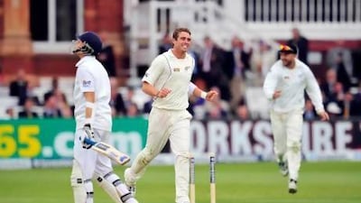 Tim Southee, right, celebrates the wicket of England's Joe Root, left.