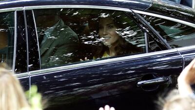 Britain's Prince William and his wife Kate, the Duchess of Cambridge, from left, arrive at German Cancer Research Centre in Heidelberg, Germany. The British Royal couple and their children are on a three-day-visit to Germany. Matthias Schrader / AP Photo