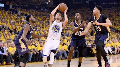 Stephen Curry of the Golden State Warriors goes up for a shot on Saturday during his team's NBA play-offs win against the New Orleans Pelicans. Thearon W Henderson / Getty Images / AFP / April 18, 2015