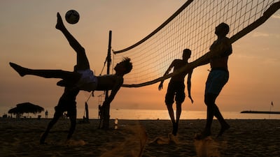 Men play footvolley on the Ramlet Al Baida public beach in Beirut, Lebanon. AP
