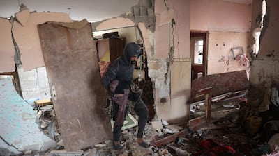 A man checks damage to a house after an Israeli strike on Nuseirat camp in the central Gaza Strip on Tuesday. AFP