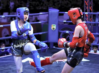 Shabnam Hussain Zada of Afghanistan blocks a kick from Tzu Ching Lin of Taipei. Victor Besa / The National