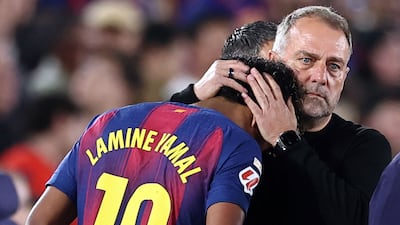 Barcelona coach Hansi Flick consoles Lamine Yamal after he is substituted due to an injury. AFP