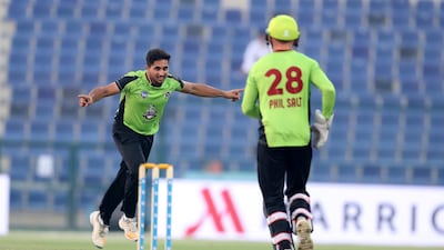 Farzan Raja of Lahore Qalanders celebrates a wicket during the Abu Dhabi T20 Trophy and he and his teammates will hope to have more to celebrate on Saturday when they play in the tournament final. Pawan Singh / The National
