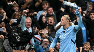 Erling Haaland celebrates scoring Manchester City's opening goal against Arsenal. It was the Norwegian striker's 100th goal for the club. AFP