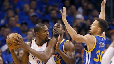 Kevin DUrant, left, produced 33 points to help Oklahoma City to a 2-1 series lead against Golden State. Sue Ogrocki / AP Photo