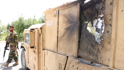 Armed Afghan security officials stand guard at a check point in Pul-e-Malan area of Guzara in Herat, Afghanistan. EPA