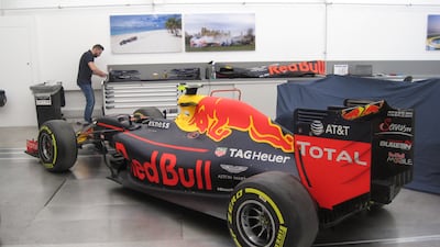 Previous years' cars in the workshop for the team's heritage programme. Photo: Daniel Bardsley for The National