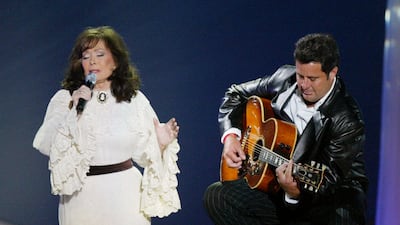 Lynn and Vince Gill perform on stage at the "39th Annual Country Music Awards" at the Mandalay Bay Hotel & Casino in Las Vegas, Nevada. Getty Images / AFP