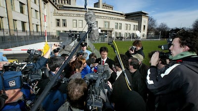 Lawyer Dragoslav Ognjanovic speaks to reporters on the second day of the war crimes trial against Slobodan Milosevic on February 13, 2002. Reuters