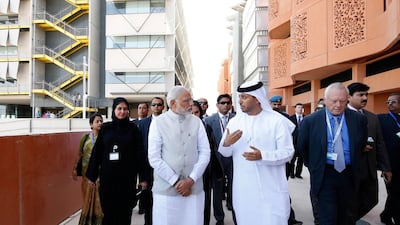 Indian prime minister Narendra Modi talks to an Emirati official in Masdar City during a state visit to the UAE in August 2015. Ryan Carter / Wam