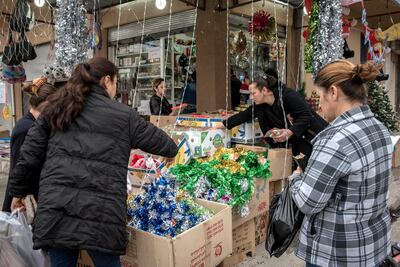Women shop for Christmas decorations in Qaraqosh, Iraq on December 20, 2017. Campbell MacDiarmid