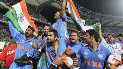 Sachin Tendulkar of India is lifted by his teammates on a lap of honour. Getty Images