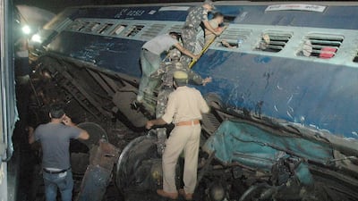 Rescue workers att he crash site where two express trains collided, some 7 km from Gorakhpur in Uttar Pradesh, India on 30 September 2014. Fourteen people died in the accident, while dozens were injured. EPA