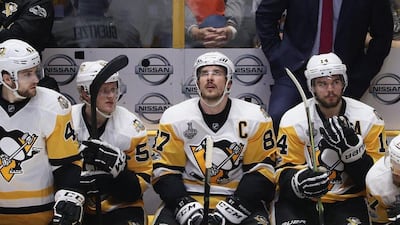 Sidney Crosby, second right, of the Pittsburgh Penguins looks on from the bench during the third period against the Nashville Predators in Game 3 of the 2017 NHL Stanley Cup Finals at the Bridgestone Arena on June 3, 2017 in Nashville, Tennessee. Patrick Smith / Getty Images