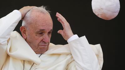 A gust of wind blows Pope Francis's skull cap off during his pastoral visit in Alessano, southern Italy. Reuters / Max Rossi.