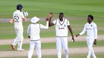 West Indies bowler Jason Holder, centre, celebrates the wicket of England's Dom Sibley. AFP