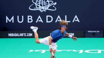Andrey Rublev hits a shot during the match against Stefanos Tsitsipas at the Mubadala World Tennis Championship at Zayed Sports City in Abu Dhabi. Chris Whiteoak / The National