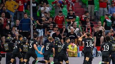 Germany's Leon Goretzka celebrates with teammates after scoring the late equaliser against Hungary. EPA