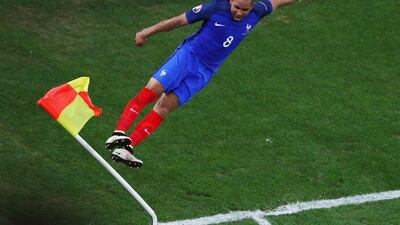 Dimitri Payet jumps at the corner flag after scoring France's second goal in a 2-0 win over Albania. Lars Baron / Getty Images