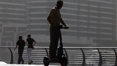 UAE residents are being urged to report cases when e-scooter riders have behaved dangerously. Chris Whiteoak / The National