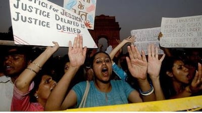 Activists shout slogans and wave placards in 2006, demanding a retrial after nine men were acquitted in the death of Jessica Lal.