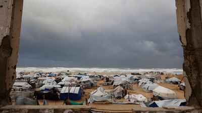Tents housing displaced Palestinian families are scattered across the shore in Gaza city, as winter weather grips the enclave. AFP
