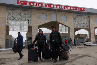 Fleeing Iranians cross into Turkey through the Kapikoy Border Gate. Reuters