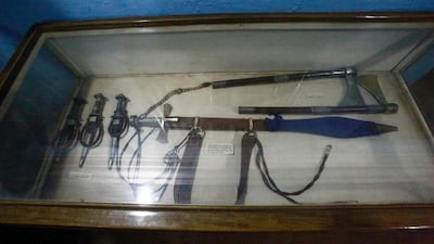 A spear, axe and daggers on display.