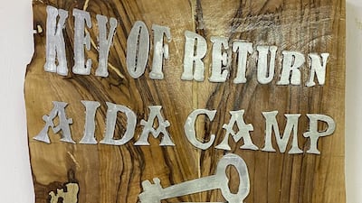 A wall sign made from olive wood and gas canisters for the Aida refugee camp, in Bethlehem, West Bank. Photo: Art48House / Instagram