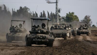 Israeli tanks and armoured personnel carriers i southern Israel on the border with the Gaza Strip on Wednesday. Getty Images
